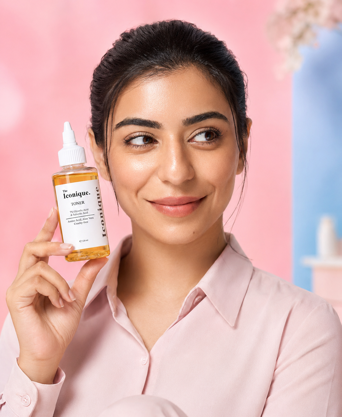 Smiling woman holding The Iconique Toner